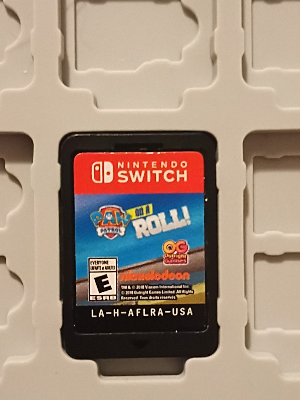 Nintendo Switch game card with red and blue label
